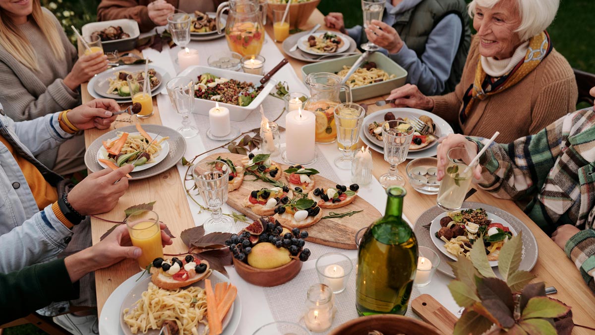 Family gathering at festive table. Photo by Askar Abayev on Pexels.