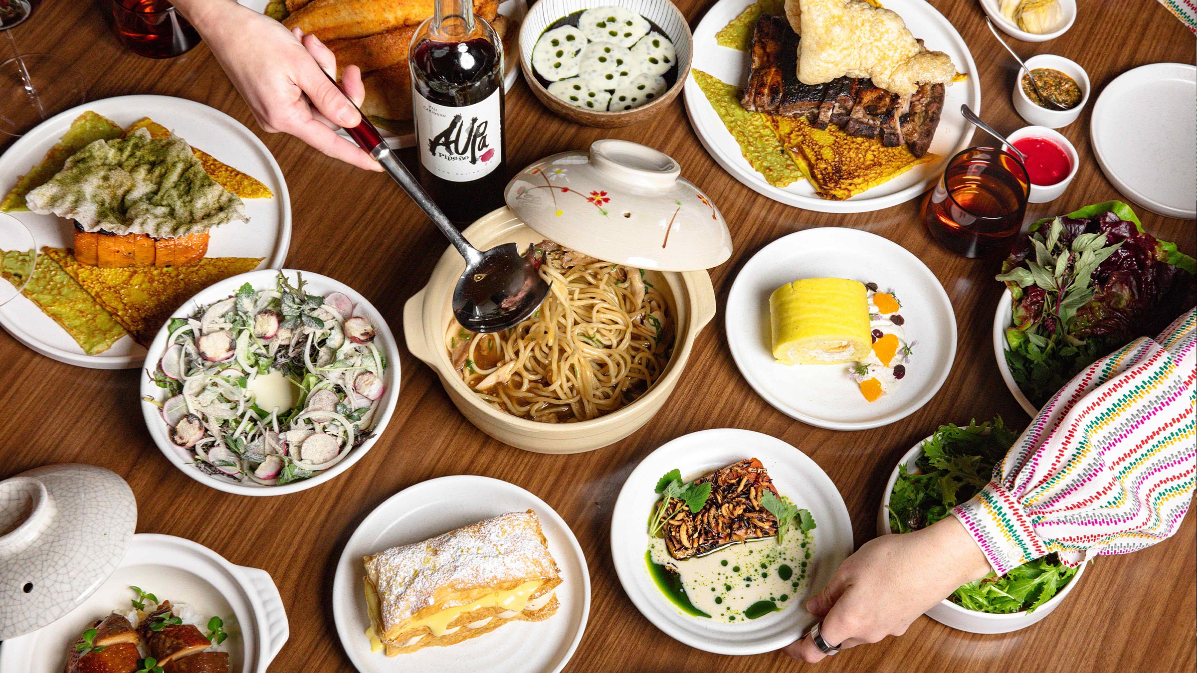 Table with plates of food at Bad Idea restaurant